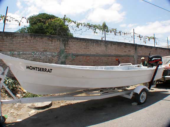 21' wood/fiberglass boat with 50HP 4 stroke Merc motor.
