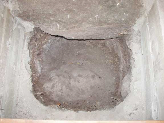 The hole in the latrine is about 4 1/2 feet deep before hitting rock.