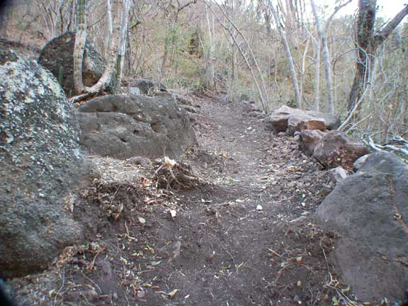 New trail to upper plateau; you have no idea how much work goes into making a trail like this.Trail off to the left between the two big rocks on the left goes to the latrine.Close enough to camp but far enough away for privacy.