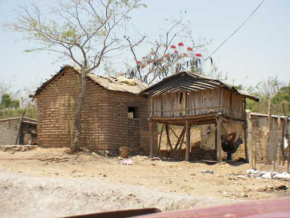 Typical Huicholi winter house on left and summer house on right.
